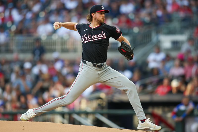 Aug 24, 2024; Atlanta, Georgia, USA; Washington Nationals starting pitcher Jake Irvin (27) throws against the Atlanta Braves in the first inning at Truist Park. Mandatory Credit: Brett Davis-USA TODAY Sports