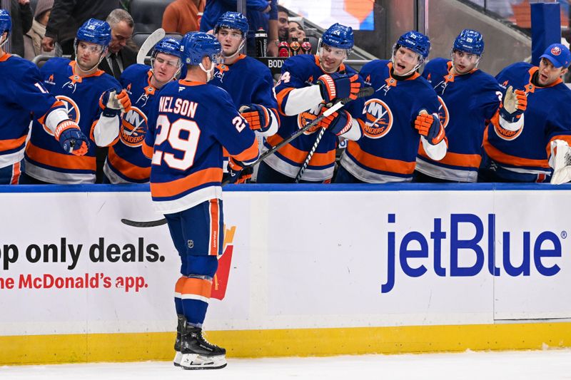 Nov 27, 2024; Elmont, New York, USA;  New York Islanders center Brock Nelson (29) celebrates his goal against the Boston Bruins during the second period at UBS Arena. Mandatory Credit: Dennis Schneidler-Imagn Images