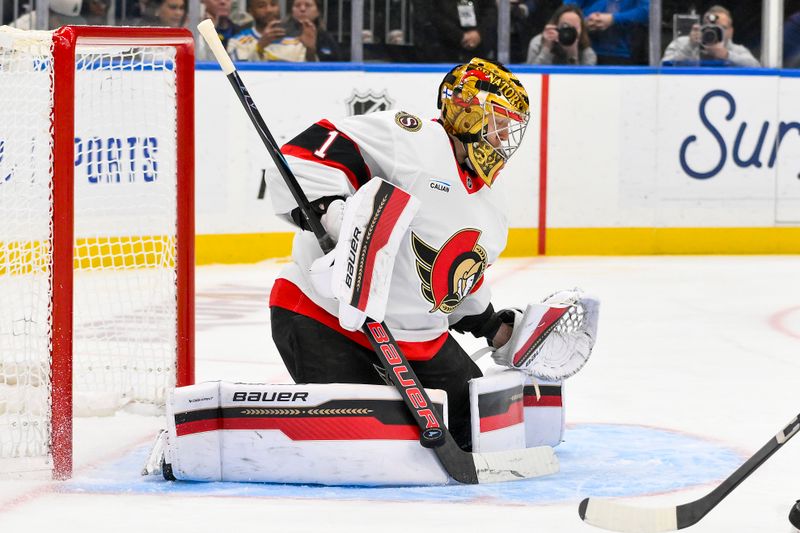 Nov 28, 2025; St. Louis, Missouri, USA; Ottawa Senators goaltender Leevi Merilainen (1) defends the net against the St. Louis Blues during the second period at Enterprise Center. Mandatory Credit: Jeff Curry-Imagn Images