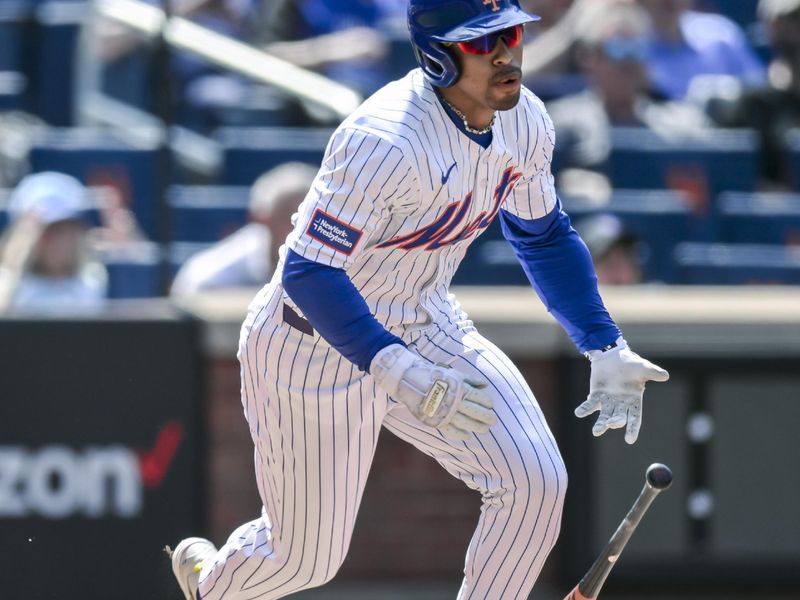 May 2, 2024; New York City, New York, USA; New York Mets shortstop Francisco Lindor (12) hits a two RBI double against the Chicago Cubs during the sixth inning at Citi Field. Mandatory Credit: John Jones-USA TODAY Sports