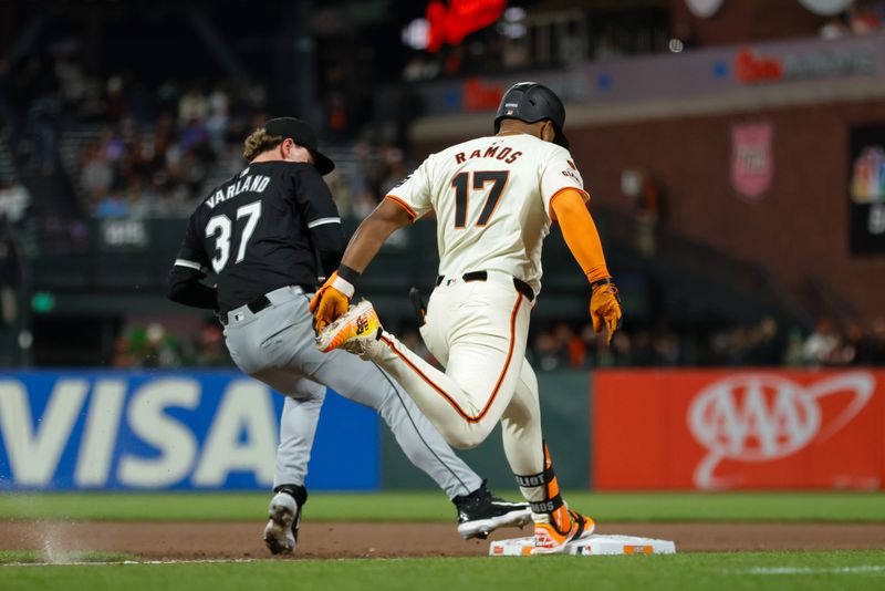 Aug 19, 2024; San Francisco, California, USA; San Francisco Giants outfielder Heliot Ramos (17) is called safe at first during the seventh inning against the Chicago White Sox at Oracle Park. Mandatory Credit: Sergio Estrada-USA TODAY Sports