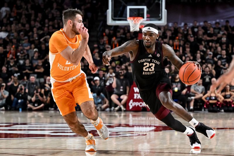 Feb 21, 2023; College Station, Texas, USA; Texas A&M Aggies guard Tyrece Radford (23) controls the ball against Tennessee Volunteers guard Santiago Vescovi (25) during the second half at Reed Arena. Mandatory Credit: Maria Lysaker-USA TODAY Sports