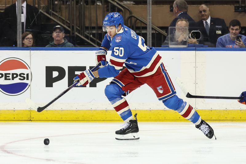 Nov 8, 2025; New York, New York, USA;  New York Rangers left wing Will Cuylle (50) chases after the puck in the first period against the New York Islanders at Madison Square Garden. Mandatory Credit: Wendell Cruz-Imagn Images