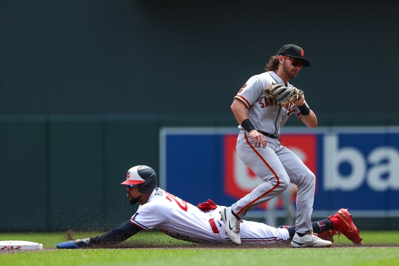 May 24, 2023; Minneapolis, Minnesota, USA; Minnesota Twins designated hitter Byron Buxton (25) steals second base as San Francisco Giants second baseman Brett Wisely (70) fields the ball in the first inning at Target Field. Mandatory Credit: Matt Krohn-USA TODAY Sports