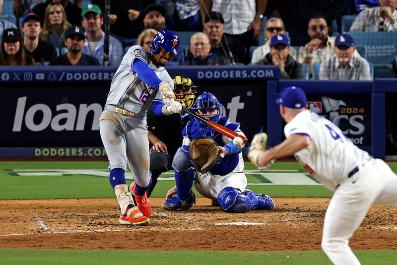 Oct 20, 2024; Los Angeles, California, USA; New York Mets shortstop Francisco Lindor (12) strikes out to end the seventh inning against the Los Angeles Dodgers during game six of the NLCS for the 2024 MLB playoffs at Dodger Stadium. Mandatory Credit: Jason Parkhurst-Imagn Images