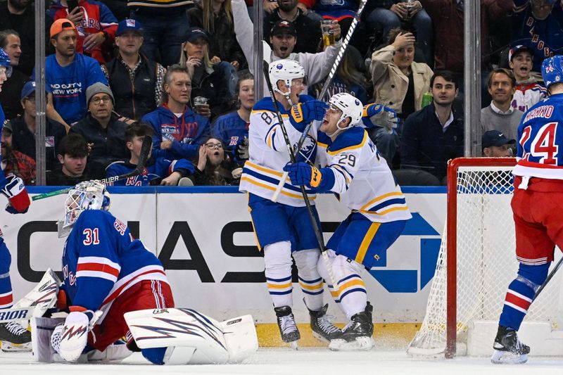 Nov 7, 2024; New York, New York, USA;  Buffalo Sabres center Sam Lafferty (81) celebrates his goal with left wing Beck Malenstyn (29) against the New York Rangers during the second period at Madison Square Garden. Mandatory Credit: Dennis Schneidler-Imagn Images