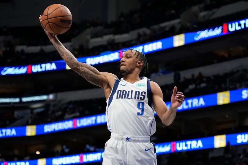 DALLAS, TEXAS - JANUARY 09: A.J. Lawson #9 of the Dallas Mavericks rebounds the ball during the second half against the Memphis Grizzlies at American Airlines Center on January 09, 2024 in Dallas, Texas. NOTE TO USER: User expressly acknowledges and agrees that, by downloading and or using this photograph, User is consenting to the terms and conditions of the Getty Images License Agreement. (Photo by Sam Hodde/Getty Images)