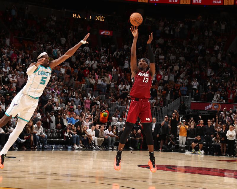 MIAMI, FL - MARCH 10:  Bam Adebayo #13 of the Miami Heat shoots a three point basket during the game against the Charlotte Hornets on March 10, 2025 at Kaseya Center in Miami, Florida. NOTE TO USER: User expressly acknowledges and agrees that, by downloading and or using this Photograph, user is consenting to the terms and conditions of the Getty Images License Agreement. Mandatory Copyright Notice: Copyright 2025 NBAE (Photo by Issac Baldizon/NBAE via Getty Images)