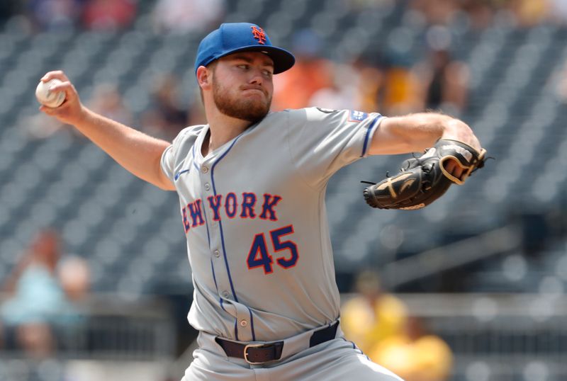 Jul 8, 2024; Pittsburgh, Pennsylvania, USA;  New York Mets starting pitcher Christian Scott (45) delivers a pitch against the Pittsburgh Pirates during the first inning  at PNC Park. Mandatory Credit: Charles LeClaire-USA TODAY Sports