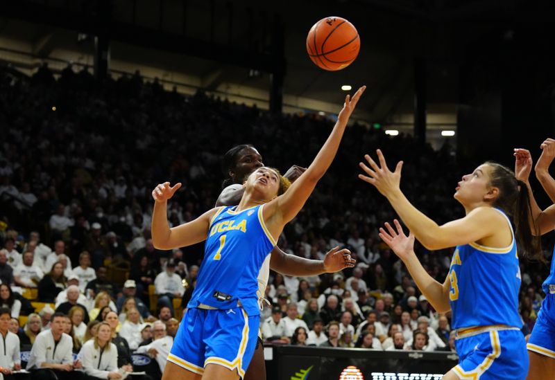 Jan 19, 2024; Boulder, Colorado, USA; UCLA Bruins guard Londynn Jones (3) and guard Kiki Rice (1) react for a rebound in the second half against the Colorado Buffaloes at the CU Events Center. Mandatory Credit: Ron Chenoy-USA TODAY Sports
\v11