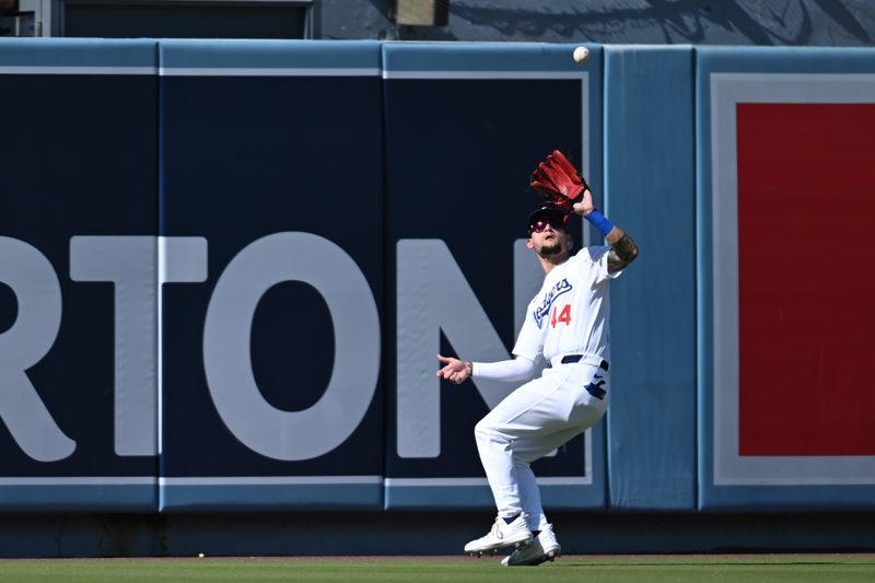 Jul 21, 2024; Los Angeles, California, USA; Los Angeles Dodgers outfielder Andy Pages (44) makes a catch against the Boston Red Sox during the first inning at Dodger Stadium. Mandatory Credit: Jonathan Hui-USA TODAY Sports