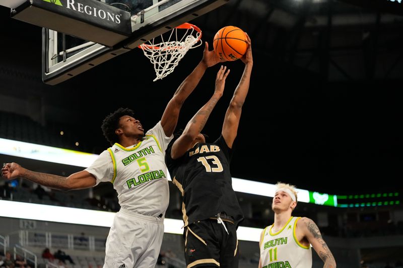 Mar 16, 2024; Fort Worth, TX, USA;  UAB Blazers forward Christian Coleman (13) has his shot blocked by South Florida Bulls guard Brandon Stroud (5) during the second half at Dickies Arena. Mandatory Credit: Chris Jones-USA TODAY Sports