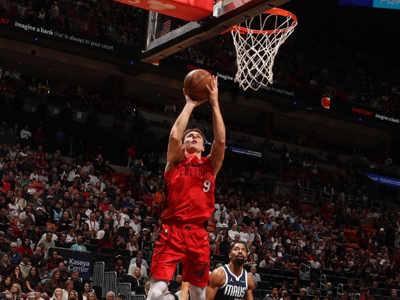 MIAMI, FL - NOVEMBER 24: Pelle Larsson #9 of the Miami Heat shoots the ball during the game against the Dallas Mavericks on November 24, 2024 at Kaseya Center in Miami, Florida. NOTE TO USER: User expressly acknowledges and agrees that, by downloading and or using this Photograph, user is consenting to the terms and conditions of the Getty Images License Agreement. Mandatory Copyright Notice: Copyright 2024 NBAE (Photo by Issac Baldizon/NBAE via Getty Images)