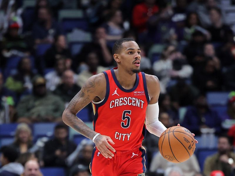 NEW ORLEANS, LOUISIANA - DECEMBER 12: Dejounte Murray #5 of the New Orleans Pelicans drives with the ball against the Sacramento Kings during a game at the Smoothie King Center on December 12, 2024 in New Orleans, Louisiana. NOTE TO USER: User expressly acknowledges and agrees that, by downloading and or using this Photograph, user is consenting to the terms and conditions of the Getty Images License Agreement. (Photo by Jonathan Bachman/Getty Images)