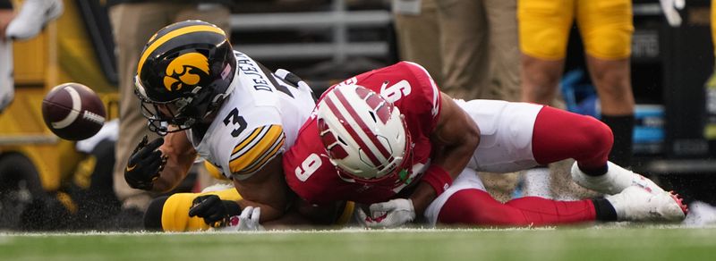 Oct 14, 2023; Madison, Wisconsin, USA; Iowa Hawkeyes defensive back Cooper DeJean (3) breaks up a pass intended for Wisconsin Badgers wide receiver Will Pauling (6) during the second quarter at Camp Randall Stadium. Mandatory Credit: Mark Hoffman-USA TODAY Sports