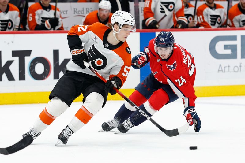 Mar 31, 2026; Washington, District of Columbia, USA; Philadelphia Flyers center Denver Barkey (52) skates with the puck as Washington Capitals left wing Connor McMichael (24) chases during the third period at Capital One Arena. Mandatory Credit: Geoff Burke-Imagn Images