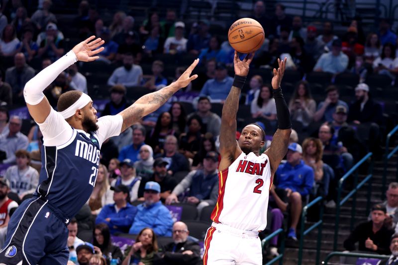 DALLAS, TEXAS - MARCH 07: Terry Rozier #2 of the Miami Heat shoots the ball against Daniel Gafford #21 of the Dallas Mavericks in the first half at American Airlines Center on March 07, 2024 in Dallas, Texas.  NOTE TO USER: User expressly acknowledges and agrees that, by downloading and or using this photograph, User is consenting to the terms and conditions of the Getty Images License Agreement. (Photo by Tim Heitman/Getty Images)