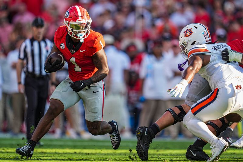 Oct 5, 2024; Athens, Georgia, USA; Georgia Bulldogs running back Trevor Etienne (1) runs against the Auburn Tigers at Sanford Stadium. Mandatory Credit: Dale Zanine-Imagn Images