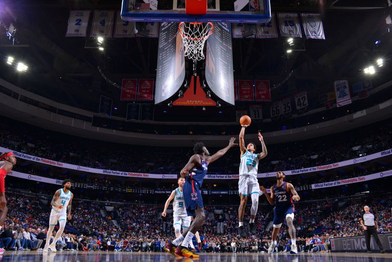 PHILADELPHIA, PA - MARCH 16: Tre Mann #23 of the Charlotte Hornets shoots the ball during the game against the Philadelphia 76ers on March 16, 2024 at the Wells Fargo Center in Philadelphia, Pennsylvania NOTE TO USER: User expressly acknowledges and agrees that, by downloading and/or using this Photograph, user is consenting to the terms and conditions of the Getty Images License Agreement. Mandatory Copyright Notice: Copyright 2024 NBAE (Photo by Jesse D. Garrabrant/NBAE via Getty Images)