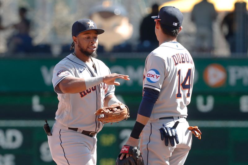 Apr 12, 2023; Pittsburgh, Pennsylvania, USA;  Houston Astros left fielder Corey Julks (9) (left) and second baseman Mauricio Dubon (14) celebrate after defeating the Pittsburgh Pirates at PNC Park. The Astros shutout the Pirates 7-0. Mandatory Credit: Charles LeClaire-USA TODAY Sports