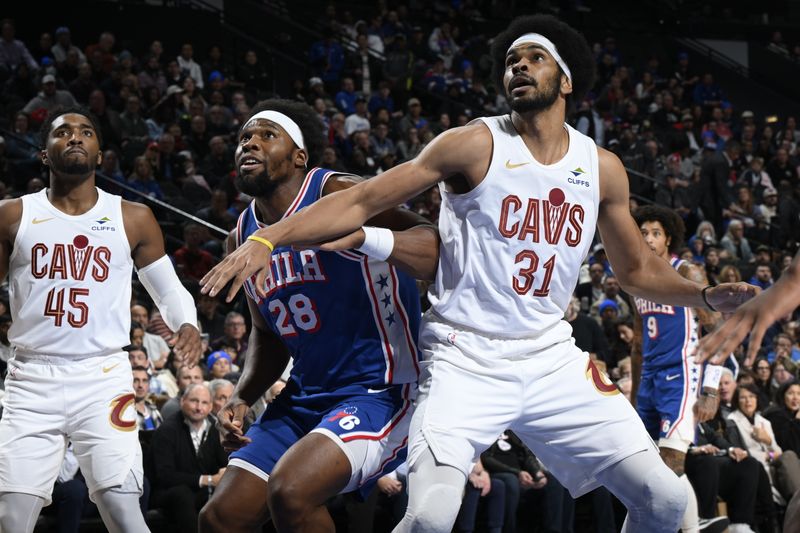 PHILADELPHIA, PA - NOVEMBER 13: Guerschon Yabusele #28 of the Philadelphia 76ers and Jarrett Allen #31 of the Cleveland Cavaliers box out during the game on November 13, 2024 at the Wells Fargo Center in Philadelphia, Pennsylvania NOTE TO USER: User expressly acknowledges and agrees that, by downloading and/or using this Photograph, user is consenting to the terms and conditions of the Getty Images License Agreement. Mandatory Copyright Notice: Copyright 2024 NBAE (Photo by David Dowt/NBAE via Getty Images)