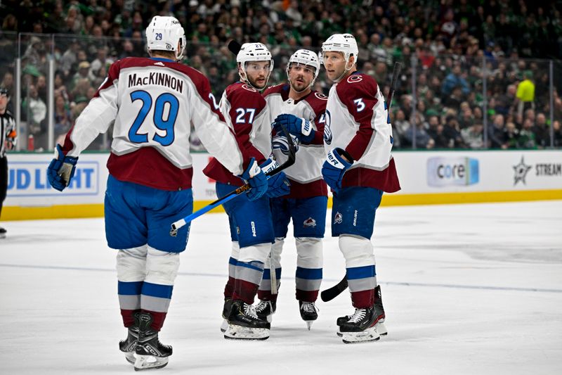 Jan 4, 2024; Dallas, Texas, USA; Colorado Avalanche center Nathan MacKinnon (29) and left wing Jonathan Drouin (27) and defenseman Samuel Girard (49) and defenseman Jack Johnson (3) celebrates a goal scored by Drouin against the Dallas Stars during the third period at the American Airlines Center. Mandatory Credit: Jerome Miron-USA TODAY Sports