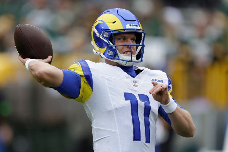 Los Angeles Rams quarterback Brett Rypien warms up before an NFL football game against the Green Bay Packers, Sunday, Nov. 5, 2023, in Green Bay, Wis. (AP Photo/Matt Ludtke)