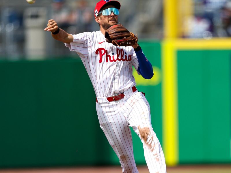 Mar 4, 2025; Clearwater, Florida, USA; Philadelphia Phillies shortstop Trea Turner (7) throws to first base against the New York Yankees in the third inning during spring training at BayCare Ballpark. Mandatory Credit: Nathan Ray Seebeck-Imagn Images