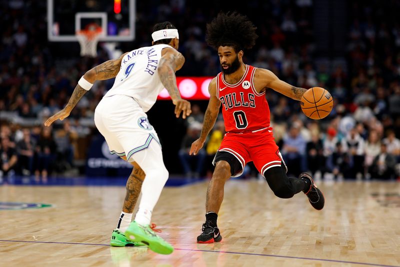 MINNEAPOLIS, MINNESOTA - MARCH 31: Coby White #0 of the Chicago Bulls dribbles the ball against Nickeil Alexander-Walker #9 of the Minnesota Timberwolves in the second quarter at Target Center on March 31, 2024 in Minneapolis, Minnesota. NOTE TO USER: User expressly acknowledges and agrees that, by downloading and or using this photograph, User is consenting to the terms and conditions of the Getty Images License Agreement. (Photo by David Berding/Getty Images)