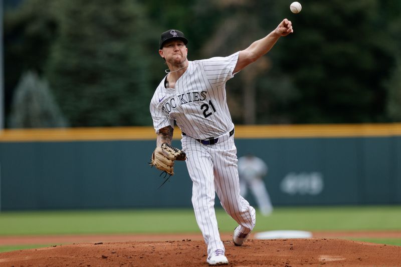 Aug 11, 2024; Denver, Colorado, USA; Colorado Rockies pitcher Kyle Freeland (21) pitches in the first inning against the Atlanta Braves at Coors Field. Mandatory Credit: Isaiah J. Downing-USA TODAY Sports