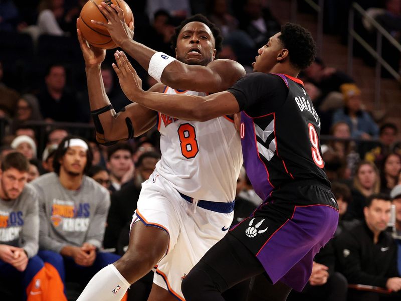 NEW YORK, NEW YORK - JANUARY 08:  OG Anunoby #8 of the New York Knicks drives against RJ Barrett #9 of the Toronto Raptors during their game at Madison Square Garden on January 08, 2025 in New York City.   User expressly acknowledges and agrees that, by downloading and or using this photograph, User is consenting to the terms and conditions of the Getty Images License Agreement.  (Photo by Al Bello/Getty Images)