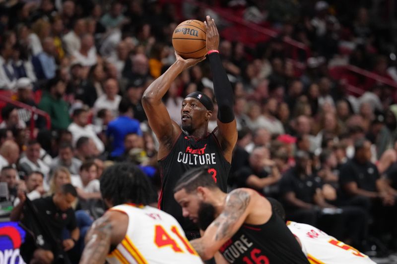 MIAMI, FL - JANUARY 19: Bam Adebayo #13 of the Miami Heat shoots the ball during the game against the Atlanta Hawks on January 19, 2024 at Kaseya Center in Miami, Florida. NOTE TO USER: User expressly acknowledges and agrees that, by downloading and or using this Photograph, user is consenting to the terms and conditions of the Getty Images License Agreement. Mandatory Copyright Notice: Copyright 2024 NBAE (Photo by Eric Espada/NBAE via Getty Images)