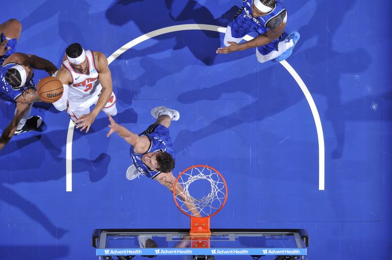 ORLANDO, FL - FEBRUARY 14: Josh Hart #3 of the New York Knicks drives to the basket during the game against the Orlando Magic on February 14, 2024 at the Kia Center in Orlando, Florida. NOTE TO USER: User expressly acknowledges and agrees that, by downloading and or using this photograph, User is consenting to the terms and conditions of the Getty Images License Agreement. Mandatory Copyright Notice: Copyright 2024 NBAE (Photo by Fernando Medina/NBAE via Getty Images)