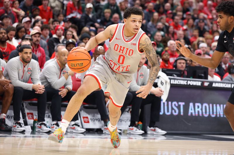 Jan 3, 2025; Columbus, Ohio, USA;  Ohio State Buckeyes guard John Mobley Jr. (0) dribbles up court during the second half against the Michigan State Spartans at Value City Arena. Mandatory Credit: Joseph Maiorana-Imagn Images