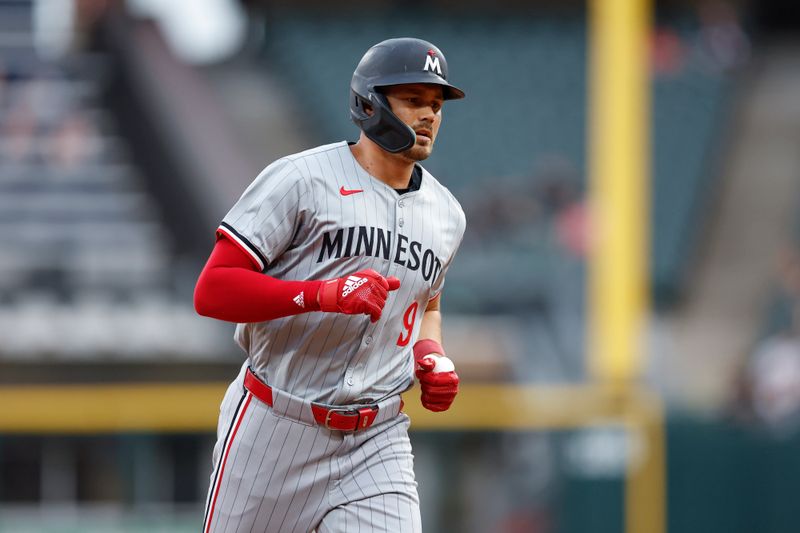 Jul 8, 2024; Chicago, Illinois, USA; Minnesota Twins outfielder Trevor Larnach (9) rounds the bases after hitting a solo home run against the Chicago White Sox during the first inning at Guaranteed Rate Field. Mandatory Credit: Kamil Krzaczynski-USA TODAY Sports