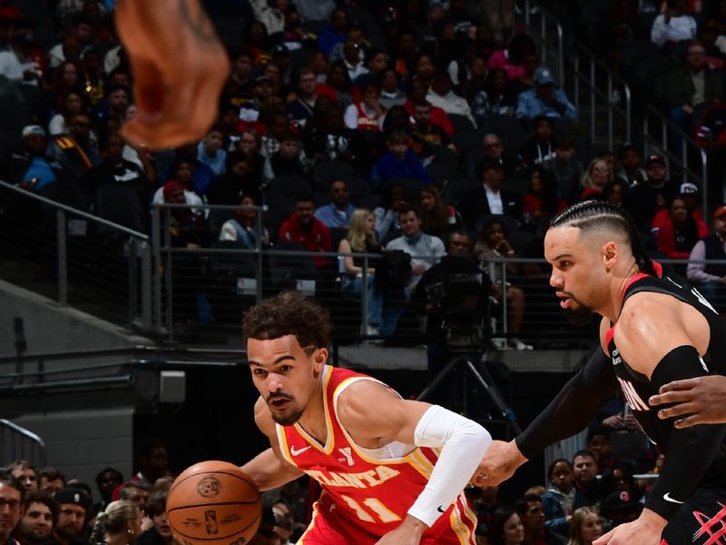 ATLANTA, GA - FEBRUARY 10: Trae Young #11 of the Atlanta Hawks dribbles the ball during the game against the Houston Rockets on February 10, 2024 at State Farm Arena in Atlanta, Georgia.  NOTE TO USER: User expressly acknowledges and agrees that, by downloading and/or using this Photograph, user is consenting to the terms and conditions of the Getty Images License Agreement. Mandatory Copyright Notice: Copyright 2024 NBAE (Photo by Scott Cunningham/NBAE via Getty Images)