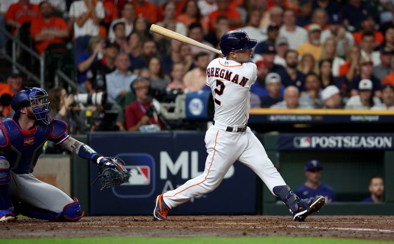 Oct 23, 2023; Houston, Texas, USA; Houston Astros third baseman Alex Bregman (2) hits a home run during the third inning of game seven in the ALCS against the Texas Rangers for the 2023 MLB playoffs at Minute Maid Park. Mandatory Credit: Thomas Shea-USA TODAY Sports