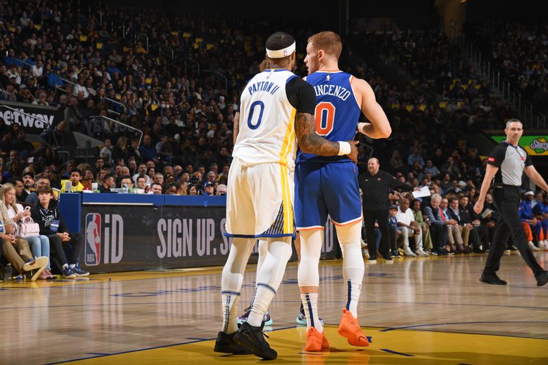 SAN FRANCISCO, CA - MARCH 18: Gary Payton II #0 of the Golden State Warriors plays defense against Donte Divincenzo #0 of the New York Knicks during the game on MARCH 18, 2024 at Chase Center in San Francisco, California. NOTE TO USER: User expressly acknowledges and agrees that, by downloading and or using this photograph, user is consenting to the terms and conditions of Getty Images License Agreement. Mandatory Copyright Notice: Copyright 2024 NBAE (Photo by Noah Graham/NBAE via Getty Images)