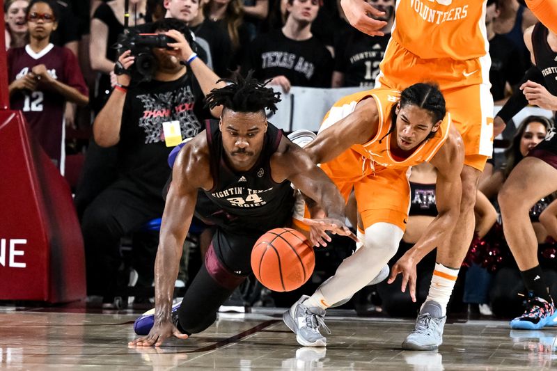 Feb 21, 2023; College Station, Texas, USA;  Tennessee Volunteers guard Zakai Zeigler (5) and Texas A&M Aggies forward Julius Marble (34) fight for a loose ball during the first half at Reed Arena. Mandatory Credit: Maria Lysaker-USA TODAY Sports