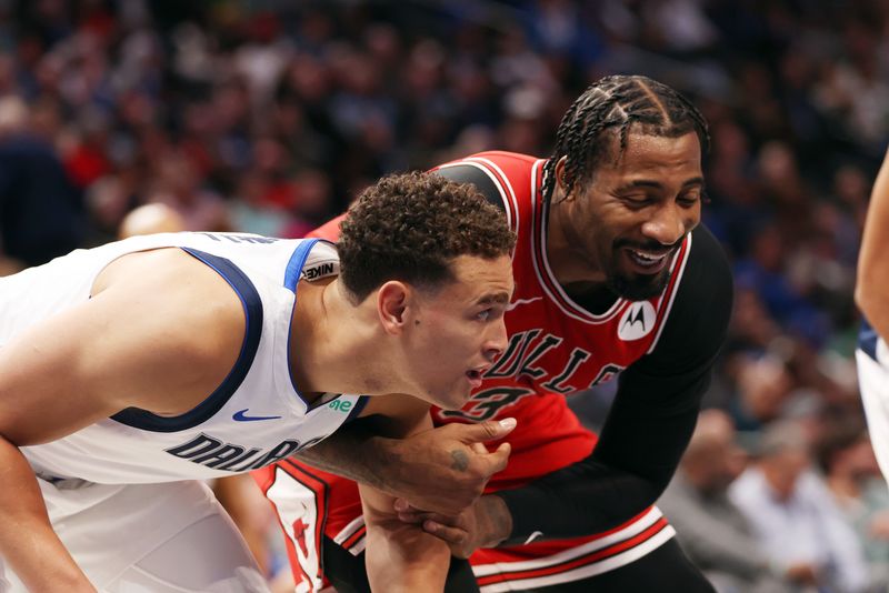 DALLAS, TEXAS - NOVEMBER 01: Dwight Powell #7 of the Dallas Mavericks and Andre Drummond #3 of the Chicago Bulls smile on the free throw line in the second half at American Airlines Center on November 01, 2023 in Dallas, Texas. NOTE TO USER: User expressly acknowledges and agrees that, by downloading and or using this photograph, User is consenting to the terms and conditions of the Getty Images License Agreement. (Photo by Tim Heitman/Getty Images)