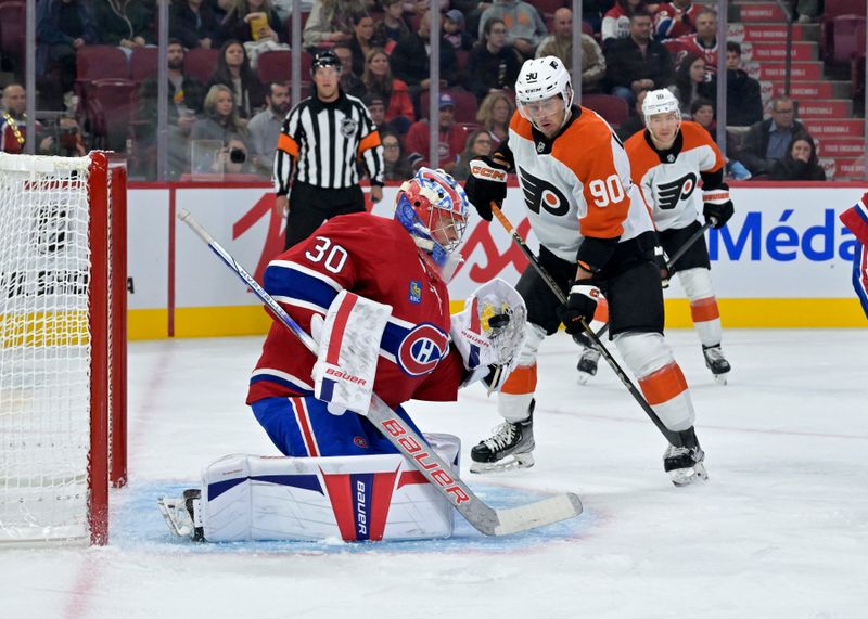 Sep 23, 2024; Montreal, Quebec, CAN; Montreal Canadiens goalie Cayden Primeau (30) makes a glove save in front of Philadelphia Flyers forward Anthony Richard (90) during the first period at the Bell Centre. Mandatory Credit: Eric Bolte-Imagn Images