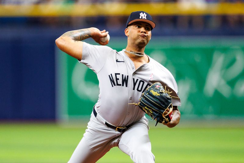 May 12, 2024; St. Petersburg, Florida, USA;  New York Yankees pitcher Luis Gil (81) throws a pitch against the Tampa Bay Rays in the first inning at Tropicana Field. Mandatory Credit: Nathan Ray Seebeck-USA TODAY Sports