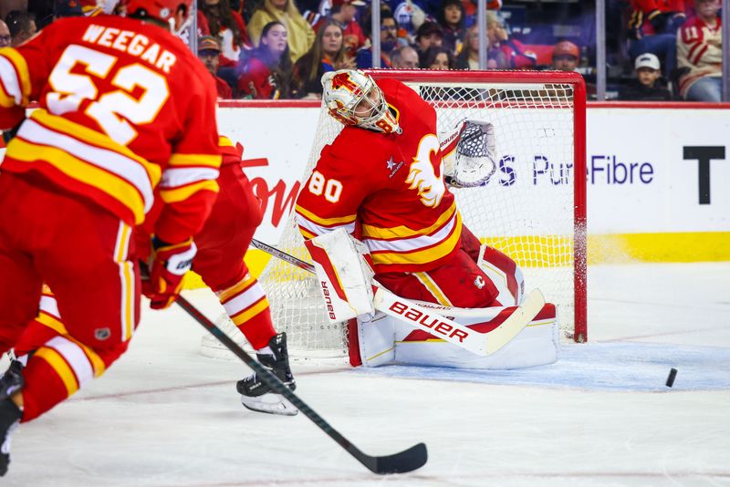 Nov 3, 2024; Calgary, Alberta, CAN; Calgary Flames goaltender Dan Vladar (80) makes a save against the Edmonton Oilers during the third period at Scotiabank Saddledome. Mandatory Credit: Sergei Belski-Imagn Images