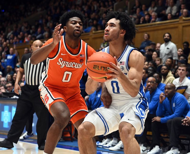 Jan 2, 2024; Durham, North Carolina, USA;  Duke Blue Devils guard Jared McCain (0) looks to shoot as Syracuse Orange guard Kyle Cuffe Jr. (0) defends during the second half at Cameron Indoor Stadium.  The Blue Devils won 86-66. Mandatory Credit: Rob Kinnan-USA TODAY Sports