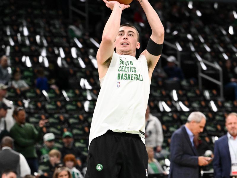 BOSTON, MASSACHUSETTS - APRIL 14: Payton Pritchard #11 of the Boston Celtics takes a shot during warmups before a game against the Washington Wizards at the TD Garden on April 14, 2024 in Boston, Massachusetts. NOTE TO USER: User expressly acknowledges and agrees that, by downloading and or using this photograph, User is consenting to the terms and conditions of the Getty Images License Agreement. (Photo by Brian Fluharty/Getty Images)