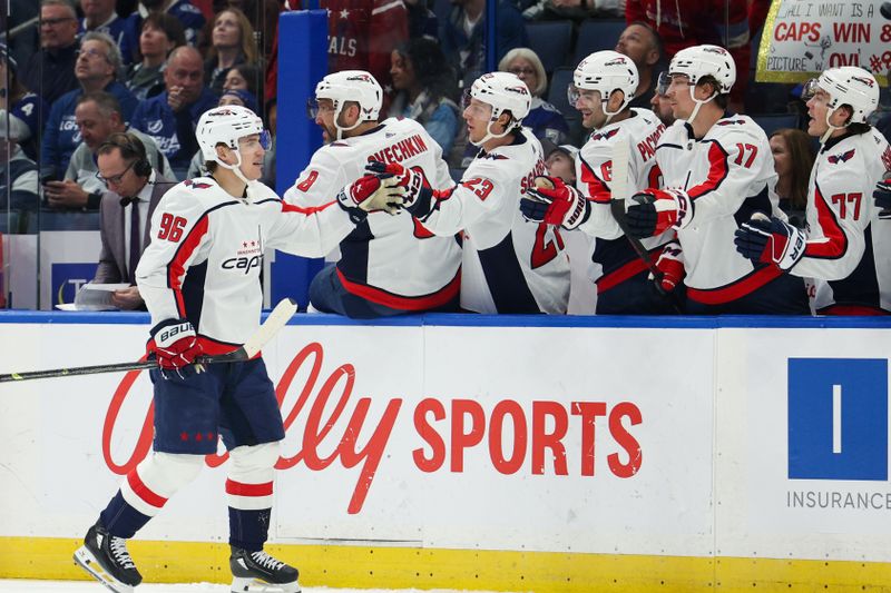 Feb 22, 2024; Tampa, Florida, USA;  Washington Capitals right wing Nicolas Aube-Kubel (96) celebrates after scoring a goal against the Tampa Bay Lightning in the first period at Amalie Arena. Mandatory Credit: Nathan Ray Seebeck-USA TODAY Sports