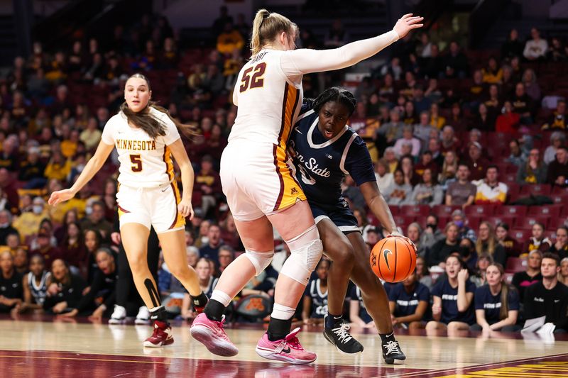 Jan 31, 2024; Minneapolis, Minnesota, USA; Penn State Nittany Lions guard Ashley Owusu (0) works around Minnesota Golden Gophers center Sophie Hart (52) during the second half at Williams Arena. Mandatory Credit: Matt Krohn-USA TODAY Sports