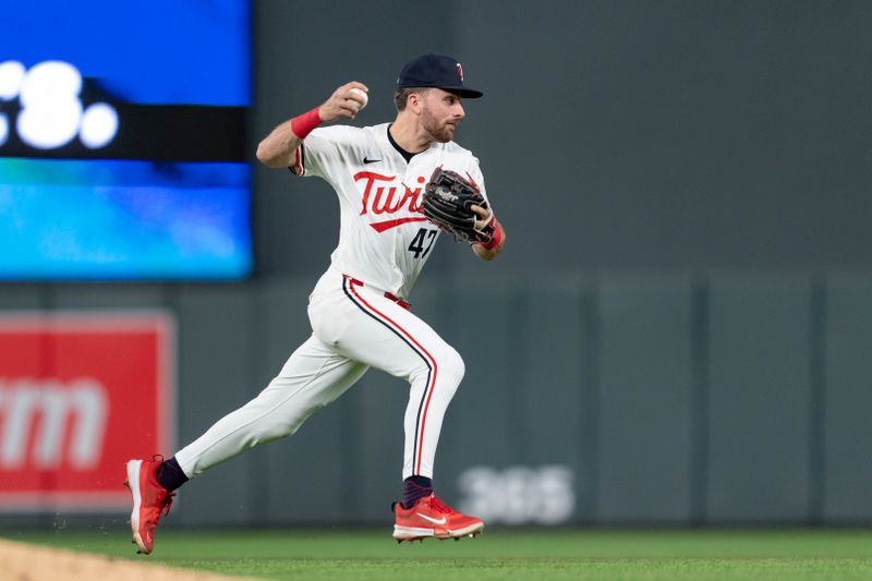 May 15, 2024; Minneapolis, Minnesota, USA; Minnesota Twins second base Edouard Julien (47) fields the ball and throws to first retiring New York Yankees catcher Jose Trevino (39) in the eighth inning at Target Field. Mandatory Credit: Matt Blewett-USA TODAY Sports