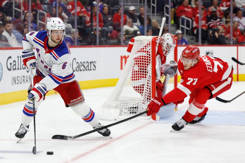 Oct 17, 2024; Detroit, Michigan, USA;  New York Rangers defenseman Zac Jones (6) skates with the puck in the third period against the Detroit Red Wings at Little Caesars Arena. Mandatory Credit: Rick Osentoski-Imagn Images