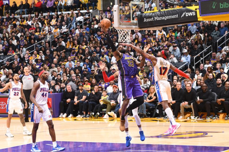 LOS ANGELES, CA - MARCH 22: LeBron James #23 of the Los Angeles Lakers drives to the basket during the game against the Philadelphia 76ers on March 22, 2024 at Crypto.Com Arena in Los Angeles, California. NOTE TO USER: User expressly acknowledges and agrees that, by downloading and/or using this Photograph, user is consenting to the terms and conditions of the Getty Images License Agreement. Mandatory Copyright Notice: Copyright 2024 NBAE (Photo by Adam Pantozzi/NBAE via Getty Images)